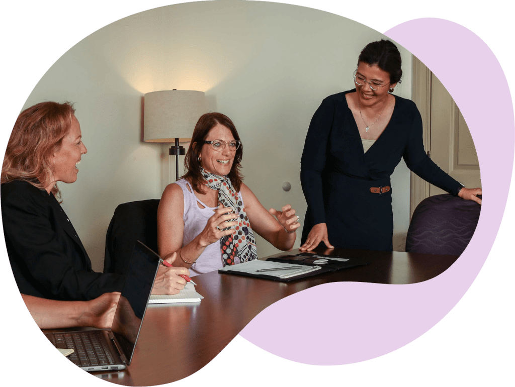 Group of women conversing in a meeting at the office.